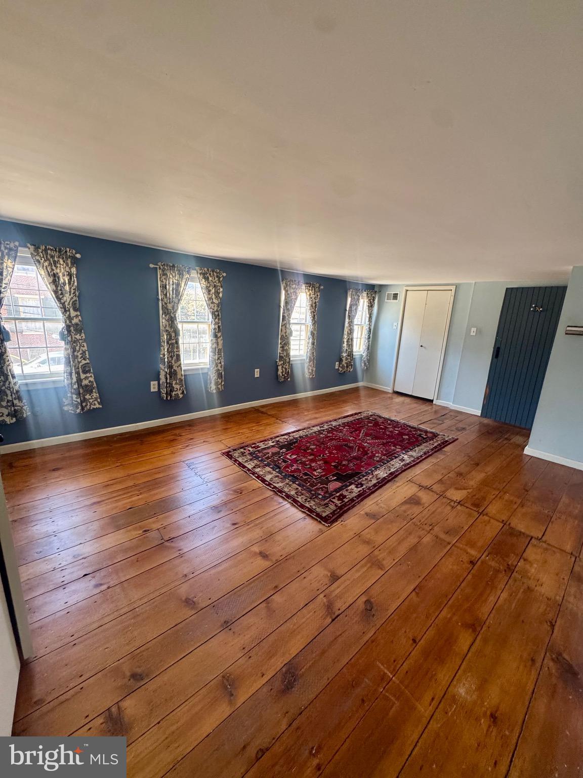 18 Market Street Salem, NJ 08079 - Photo 19 of 39 a view of a bedroom with wooden floor and window