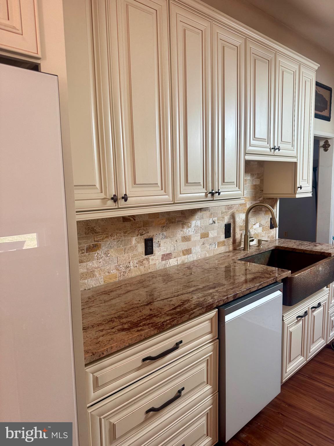 18 Market Street Salem, NJ 08079 - Photo 2 of 39 a kitchen with stainless steel appliances granite countertop a stove a sink and dishwasher with white cabinets