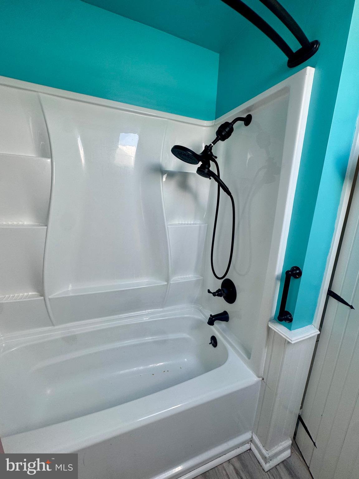 18 Market Street Salem, NJ 08079 - Photo 26 of 39 a bathroom with a bath tub and a shower