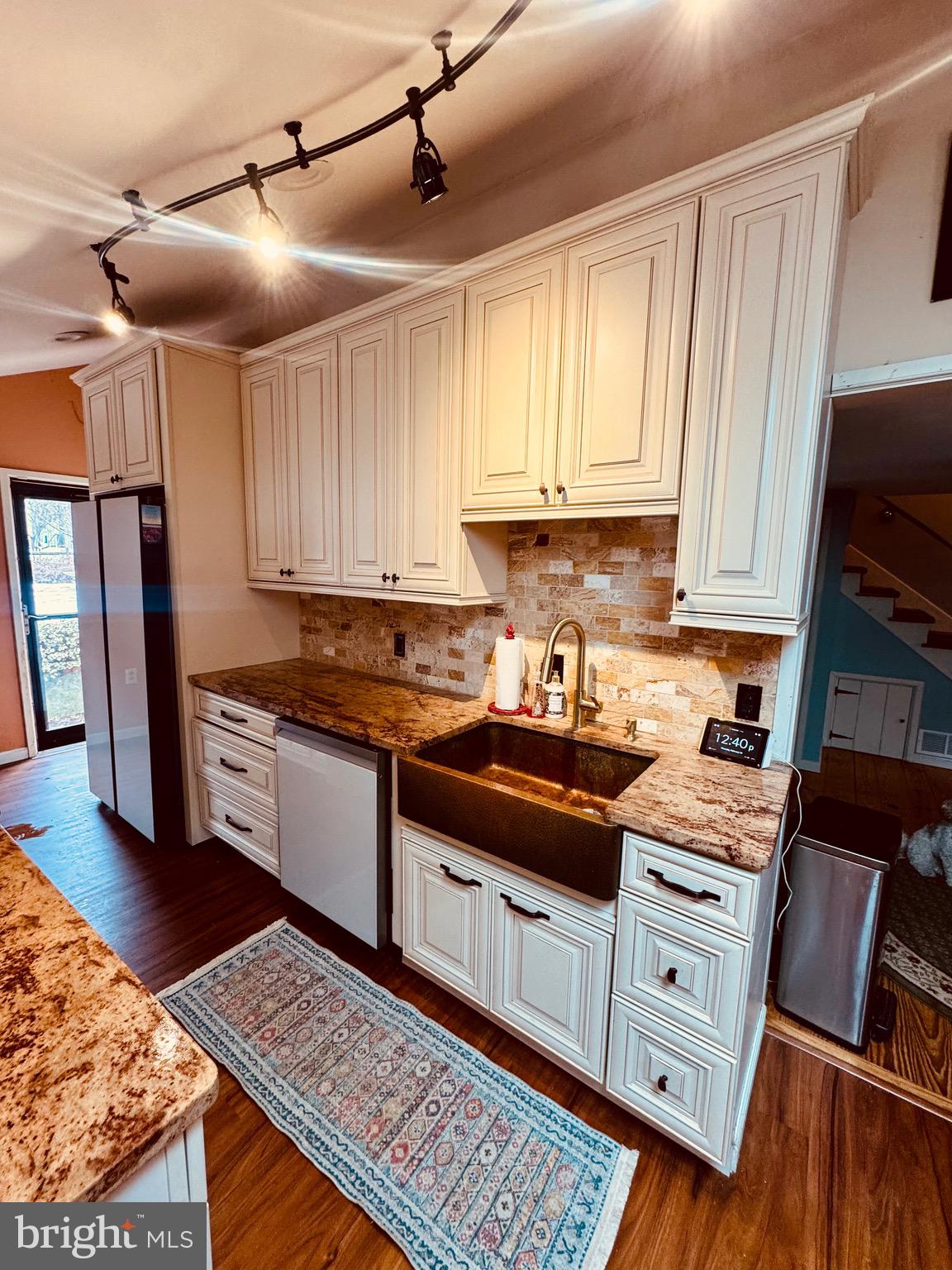 18 Market Street Salem, NJ 08079 - Photo 3 of 39 a kitchen with cabinets appliances and a wooden floor