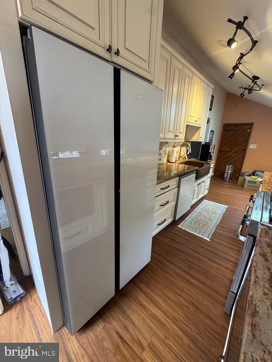 18 Market Street Salem, NJ 08079 - Photo 6 of 39 a kitchen with wooden floor and electronic appliances