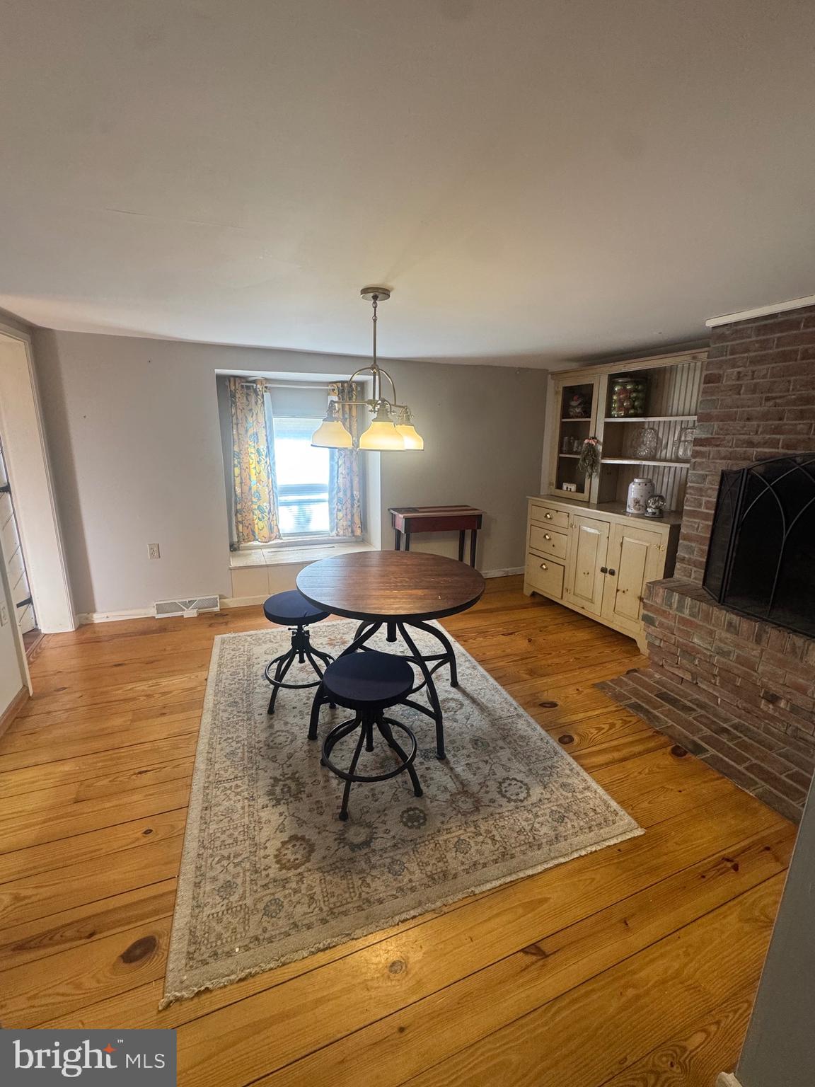 18 Market Street Salem, NJ 08079 - Photo 10 of 39 a living room with furniture and a fireplace