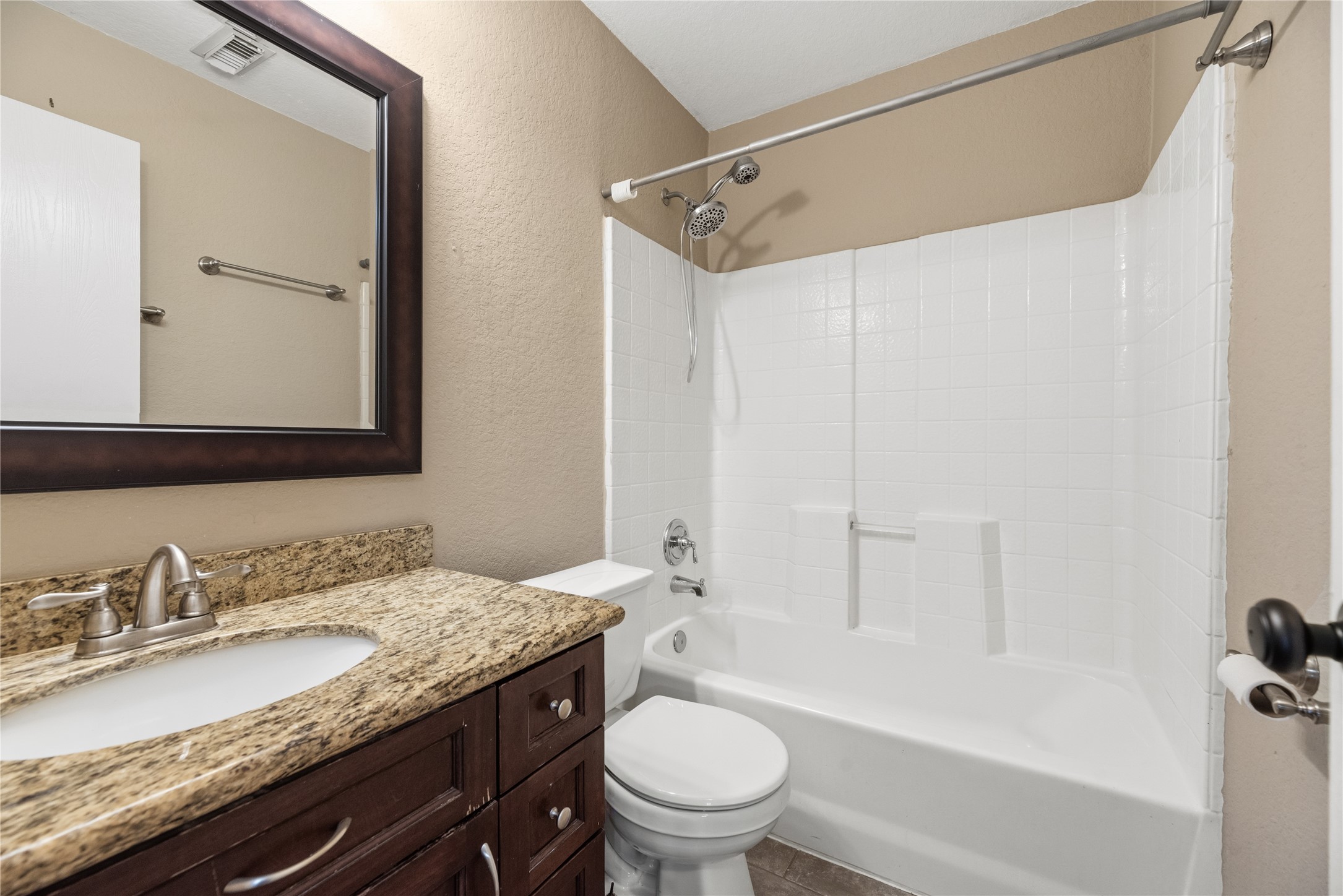 24006 Lazy Kay Lane Hockley, TX 77447 - Photo 18 of 21 Secondary Bathroom featuring granite counter tops and shower/bathtub combo.