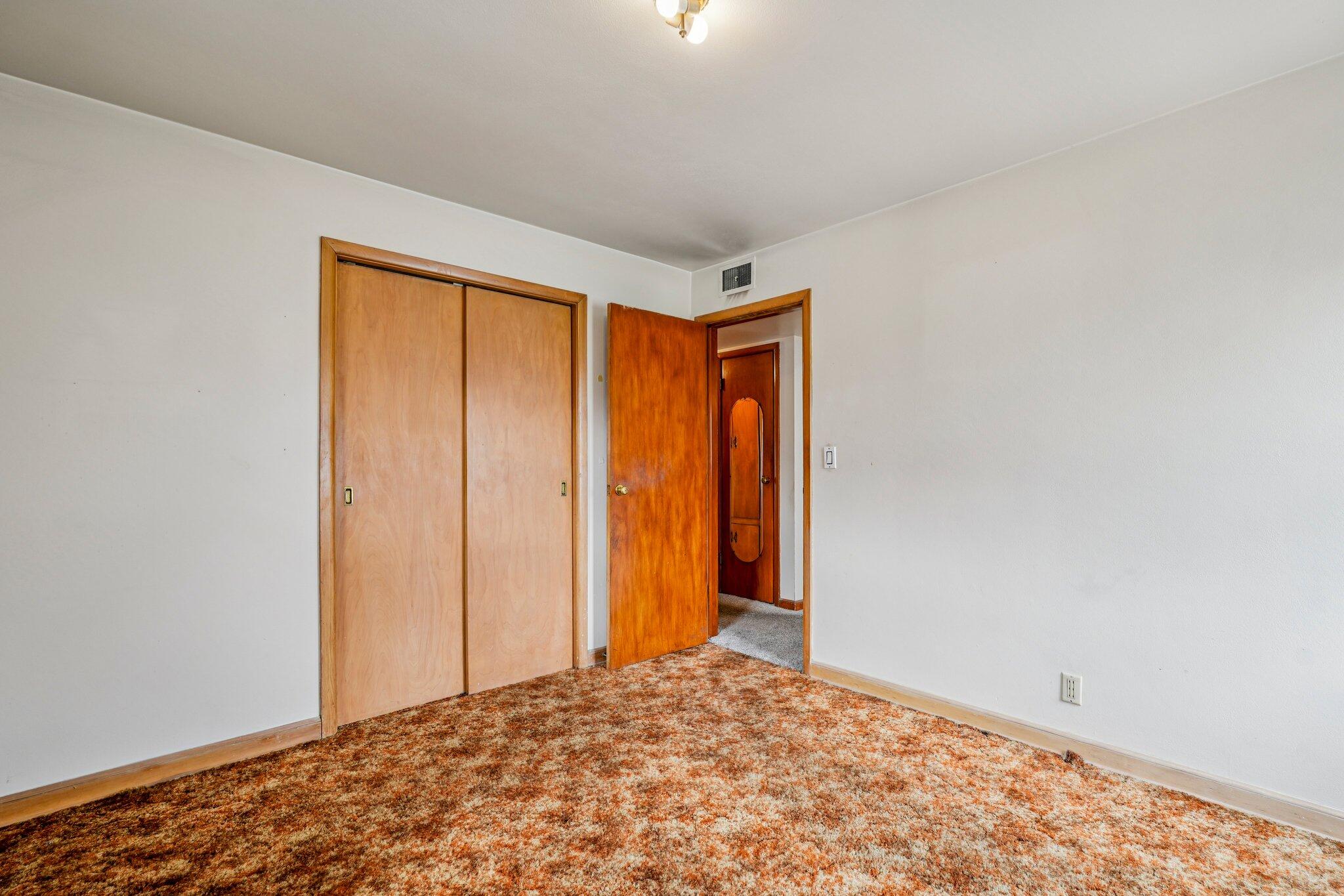 4518 North 68th Street Milwaukee, WI 53218 - Photo 17 of 34 Sliding double-door closet extends to behind room door.
