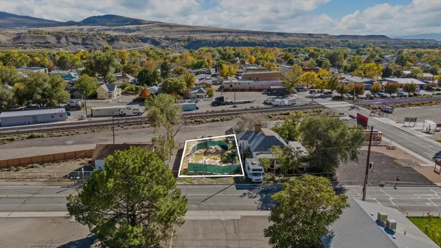 a view of a water fountain and potted plants