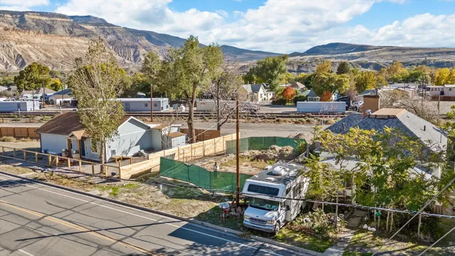 a view of a chairs and table in patio