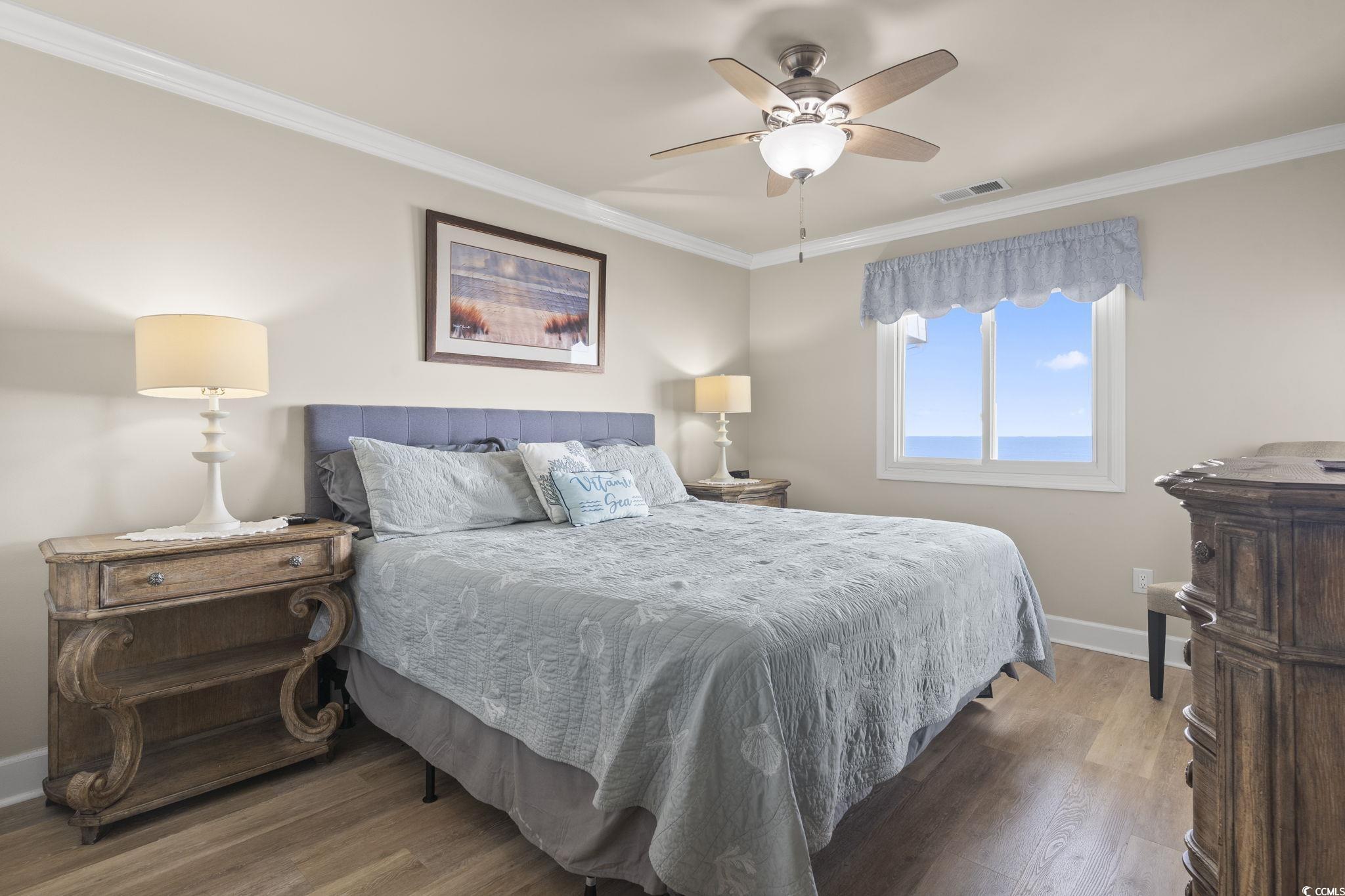1111 North Ocean Boulevard, Unit 305 Surfside Beach, SC 29575 - Photo 22 of 38 Master bedroom with oceanfront views and a private entrance to the balcony