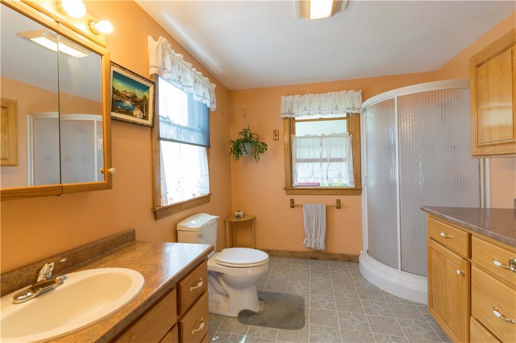 112 Bunker Hill Road Lagrange, ME 04453 - Photo 9 of 13 Bathroom with custom oak cabinets