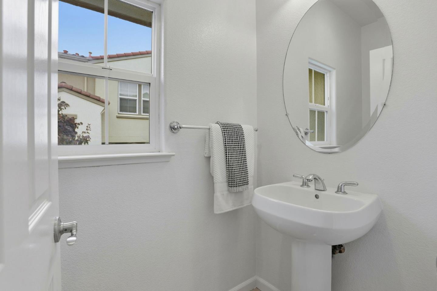 745 Mente Linda Loop Milpitas, CA 95035 - Photo 12 of 33 a bathroom with a sink and a mirror