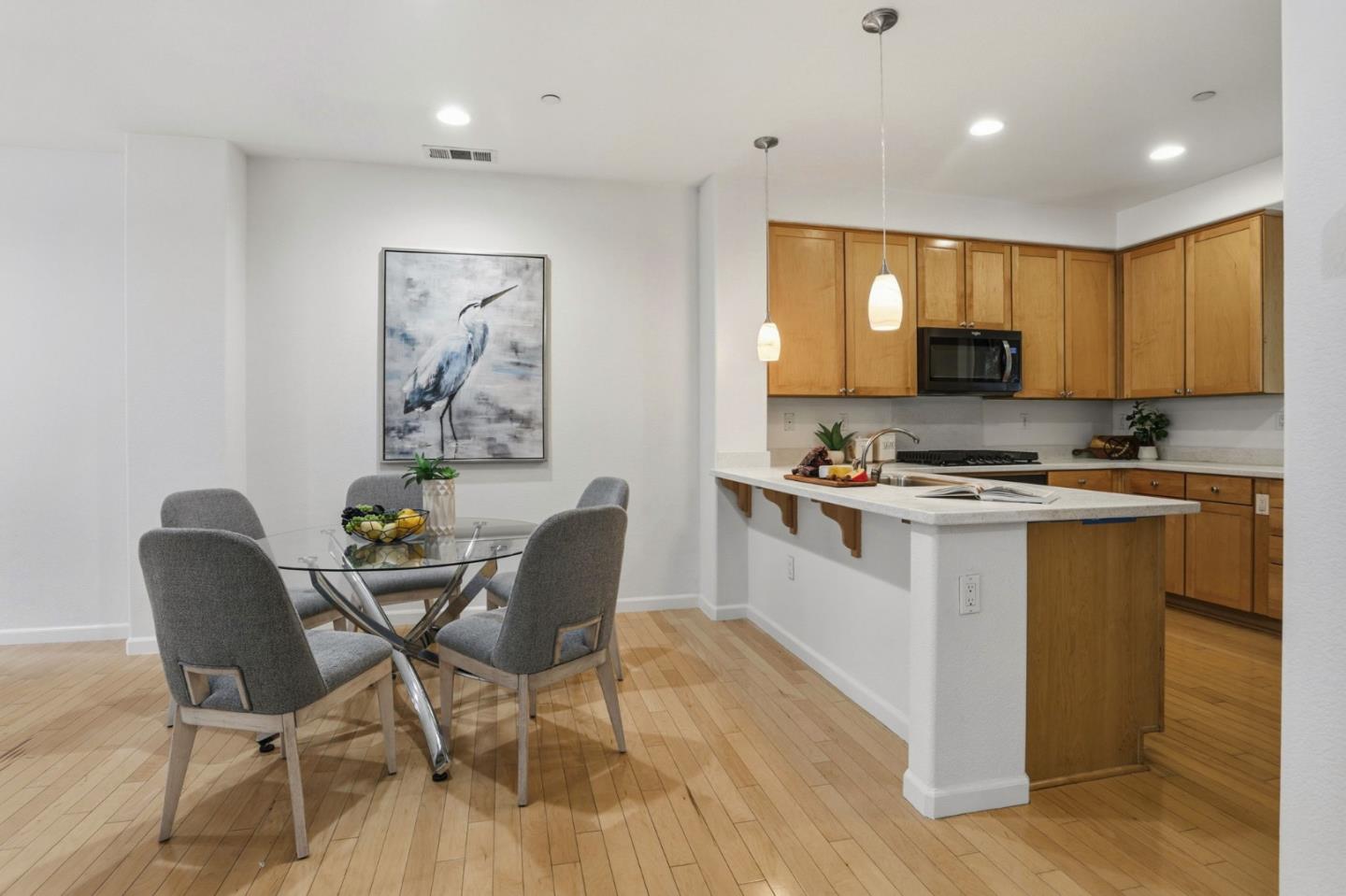 745 Mente Linda Loop Milpitas, CA 95035 - Photo 10 of 33 a kitchen with granite countertop a stove a sink a dining table and chairs