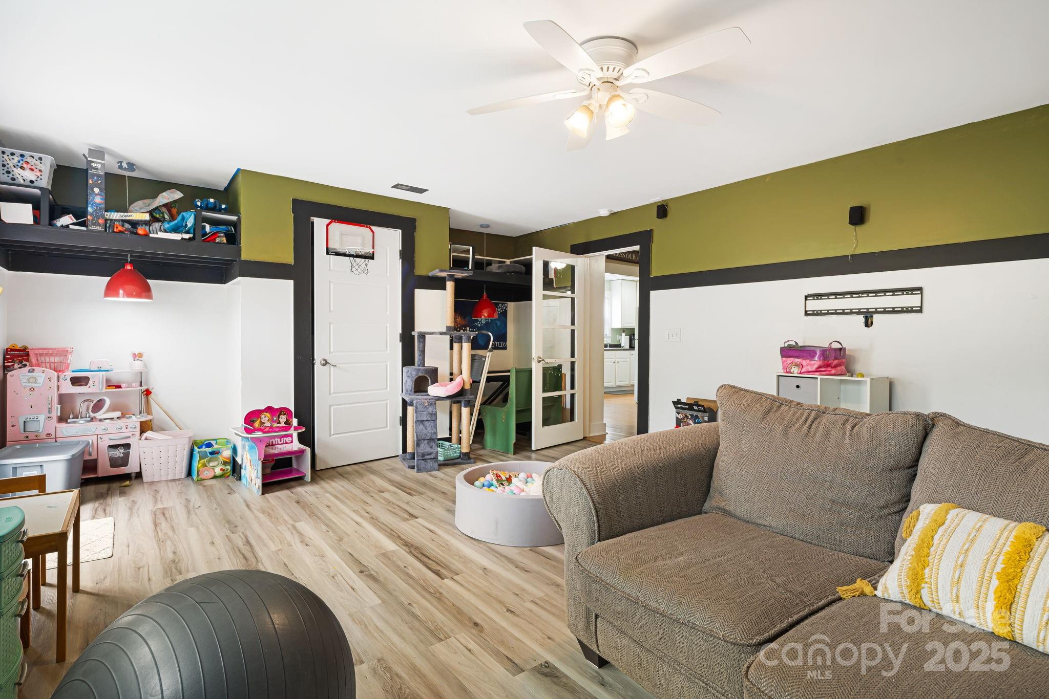 160 Lumber River Road Fletcher, NC 28732 - Photo 15 of 23 a living room with furniture and a flat screen tv