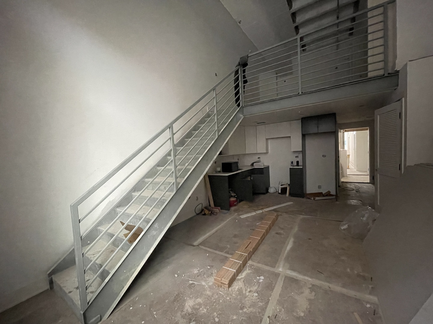 1453 Maple Avenue, Unit 102 Evanston, IL 60201 - Photo 14 of 21 a view of an empty room with stairs