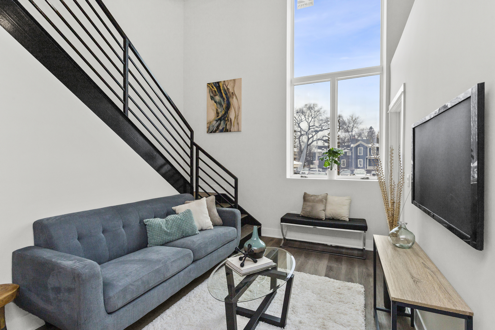 1453 Maple Avenue, Unit 102 Evanston, IL 60201 - Photo 2 of 21 a living room with furniture and a flat screen tv