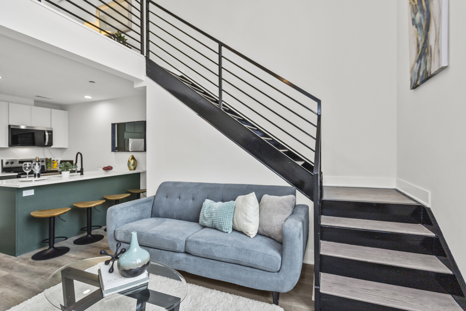 1453 Maple Avenue, Unit 102 Evanston, IL 60201 - Photo 3 of 21 a living room with furniture and kitchen view