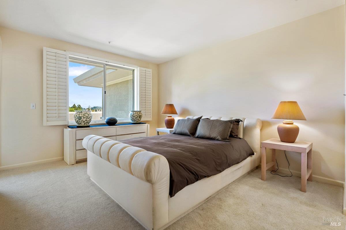 400 Deer Valley Road, Unit 4D San Rafael, CA 94903 - Photo 12 of 50 Plantation-style shutters in the primary suite.