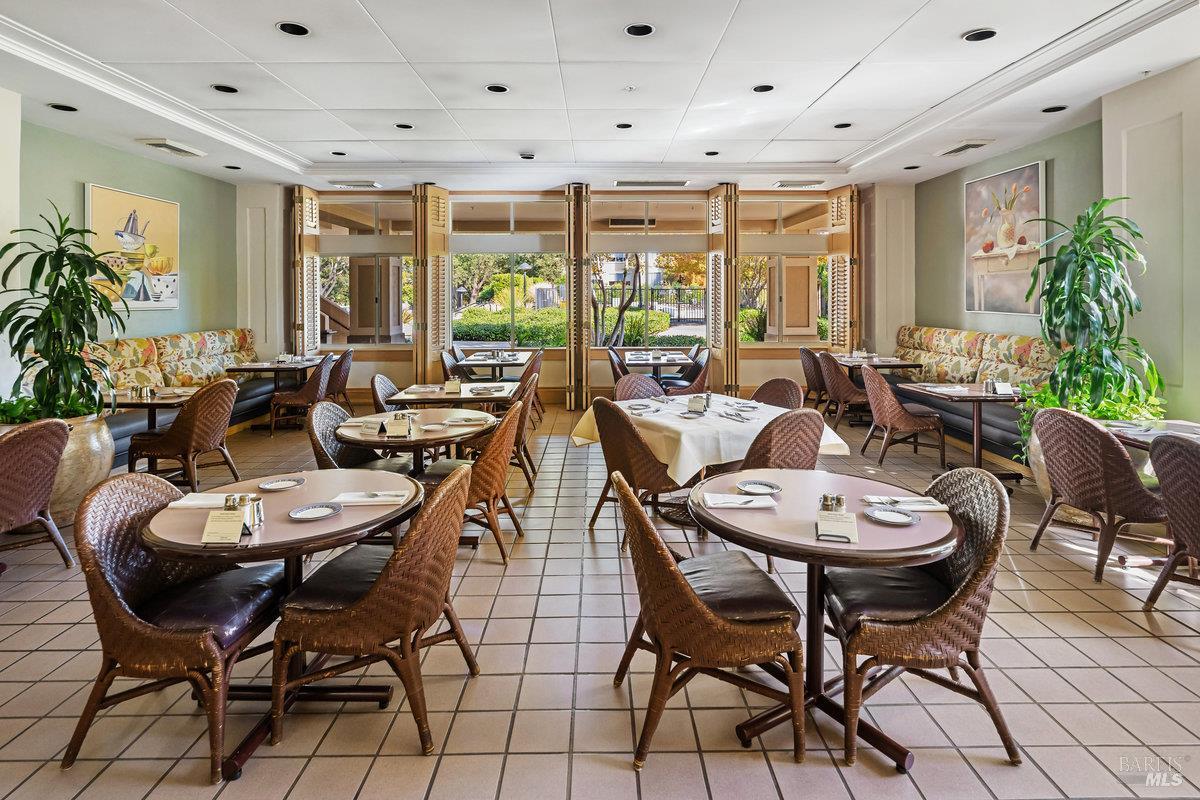 400 Deer Valley Road, Unit 4D San Rafael, CA 94903 - Photo 34 of 50 The Bistro for casual e night and dinners and has a lovely patio with umbrella tables surrounded by greenery for outdoor dining.