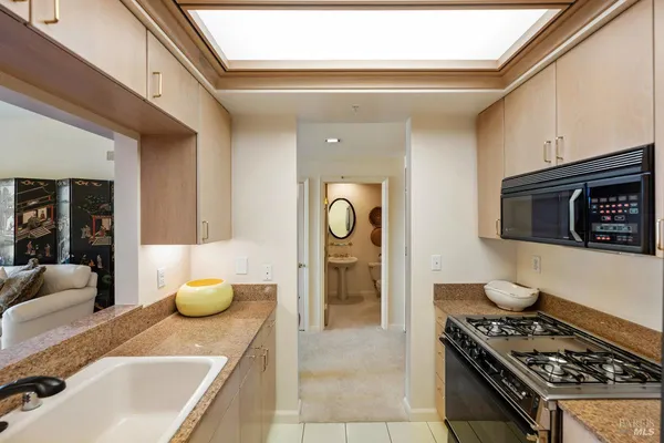 a kitchen with a refrigerator stove and microwave