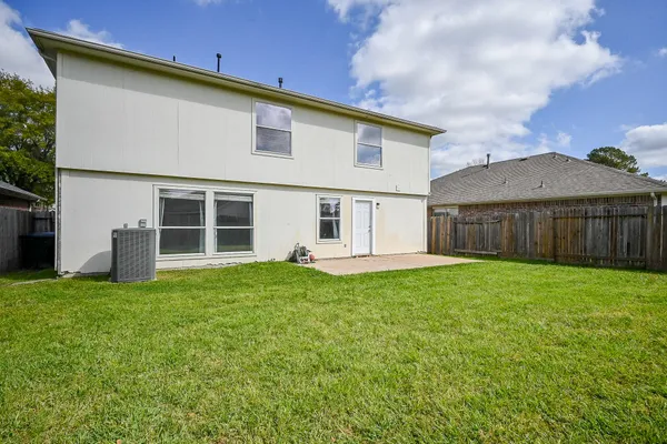 a view of a house with a back yard