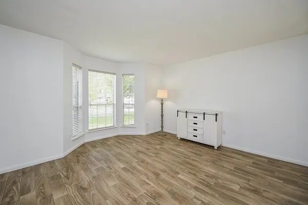 a view of a livingroom with wooden floor