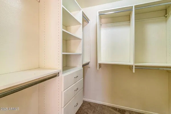a view of an empty walk in closet