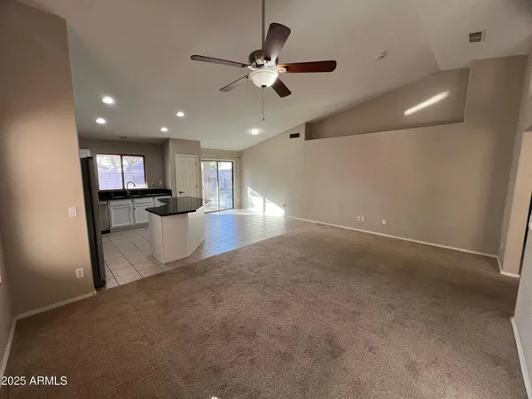 a view of a kitchen with a sink and a window