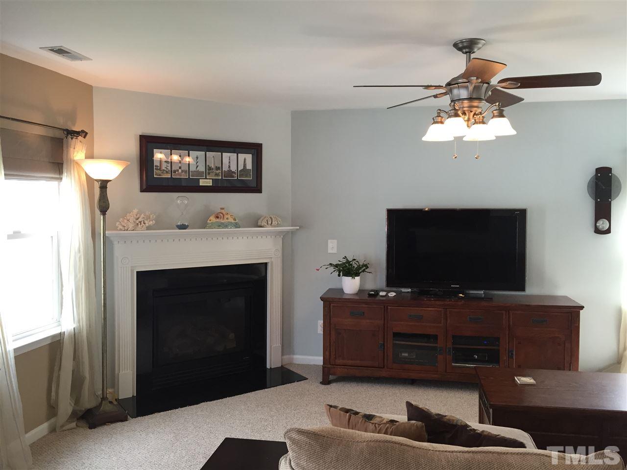 1925 Raj Drive Durham, NC 27703 - Photo 24 of 25 Open floor plan, fireplace with gas logs, lots of natural light and upgraded ceiling fan with remote control!