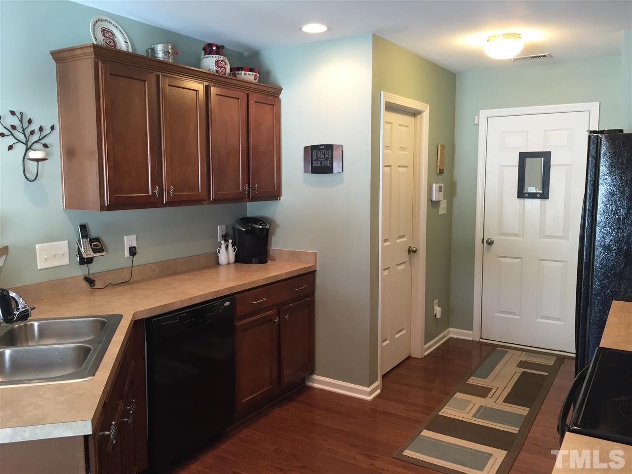 1925 Raj Drive Durham, NC 27703 - Photo 7 of 25 Beautiful cabinets with molding. Nice matching black appliances and lots of counter space!