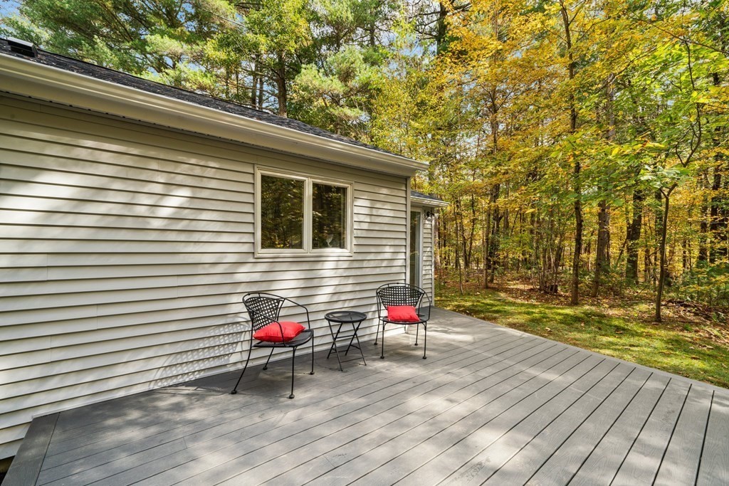 31 Hudson Road Bolton, MA 01740 - Photo 18 of 23 a view of a wooden floor and a yard view