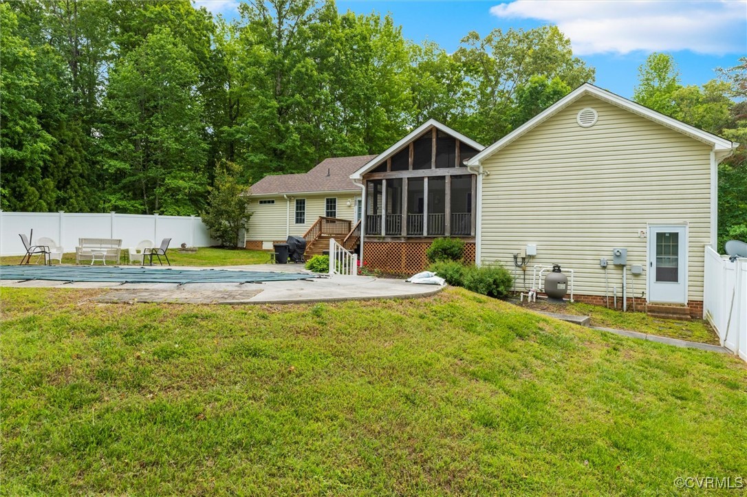 2655 Dorset Ridge Road Powhatan, VA 23139 - Photo 13 of 50 Rear view of property with a sunroom, a patio, and