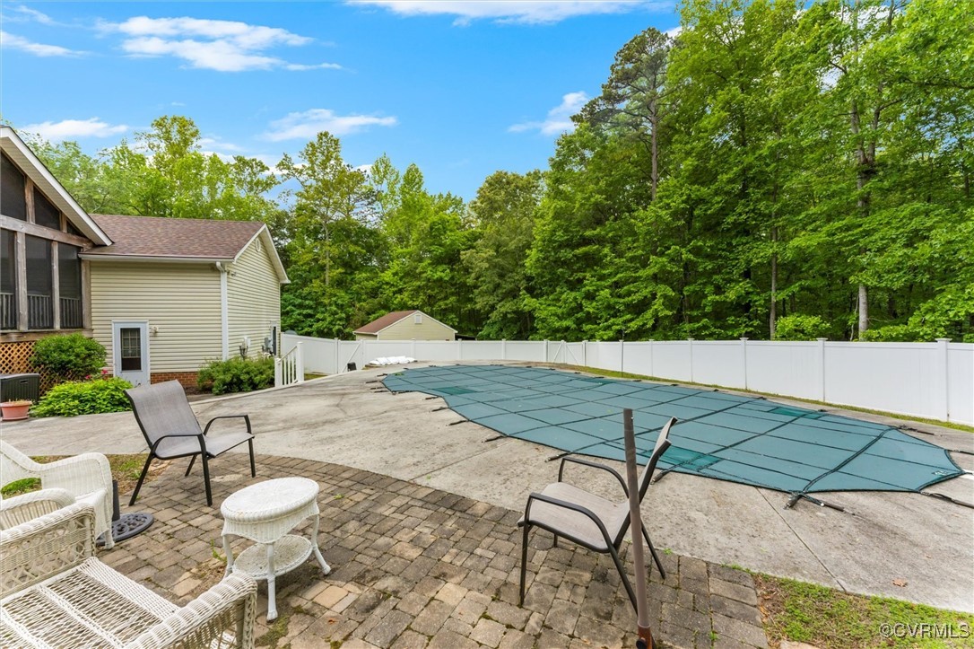 2655 Dorset Ridge Road Powhatan, VA 23139 - Photo 16 of 50 View of pool with a patio area and fence