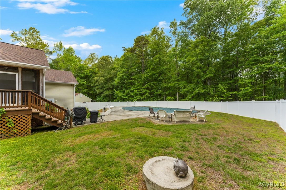 2655 Dorset Ridge Road Powhatan, VA 23139 - Photo 17 of 50 View of yard with a sunroom, a patio, and stairway