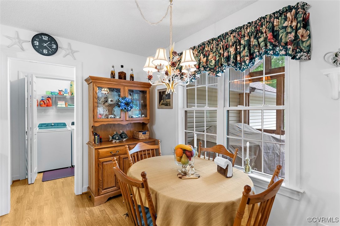 2655 Dorset Ridge Road Powhatan, VA 23139 - Photo 29 of 50 Dining area with a chandelier, light wood-style fl