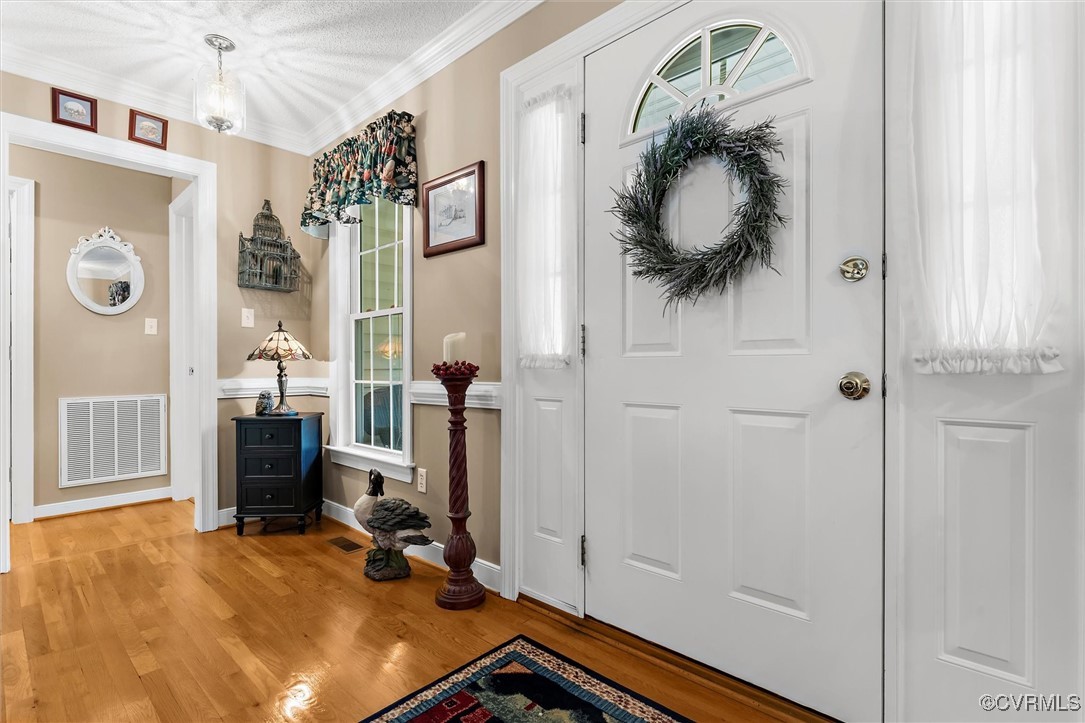 2655 Dorset Ridge Road Powhatan, VA 23139 - Photo 38 of 50 Foyer with light wood-style floors and ornamental