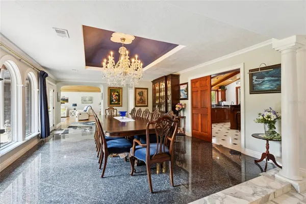 a view of a livingroom with furniture hardwood floor and a ceiling fan