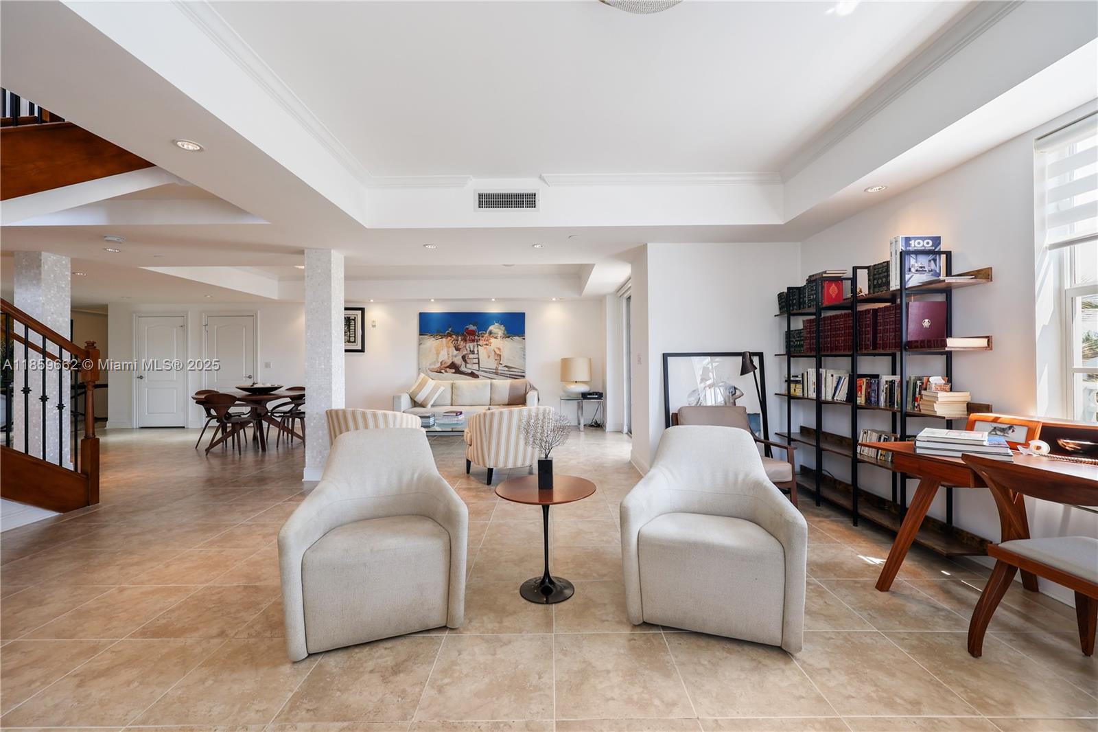 110 Hendricks Isle, Unit 13 Fort Lauderdale, FL 33301 - Photo 13 of 80 a living room with furniture and a book shelf