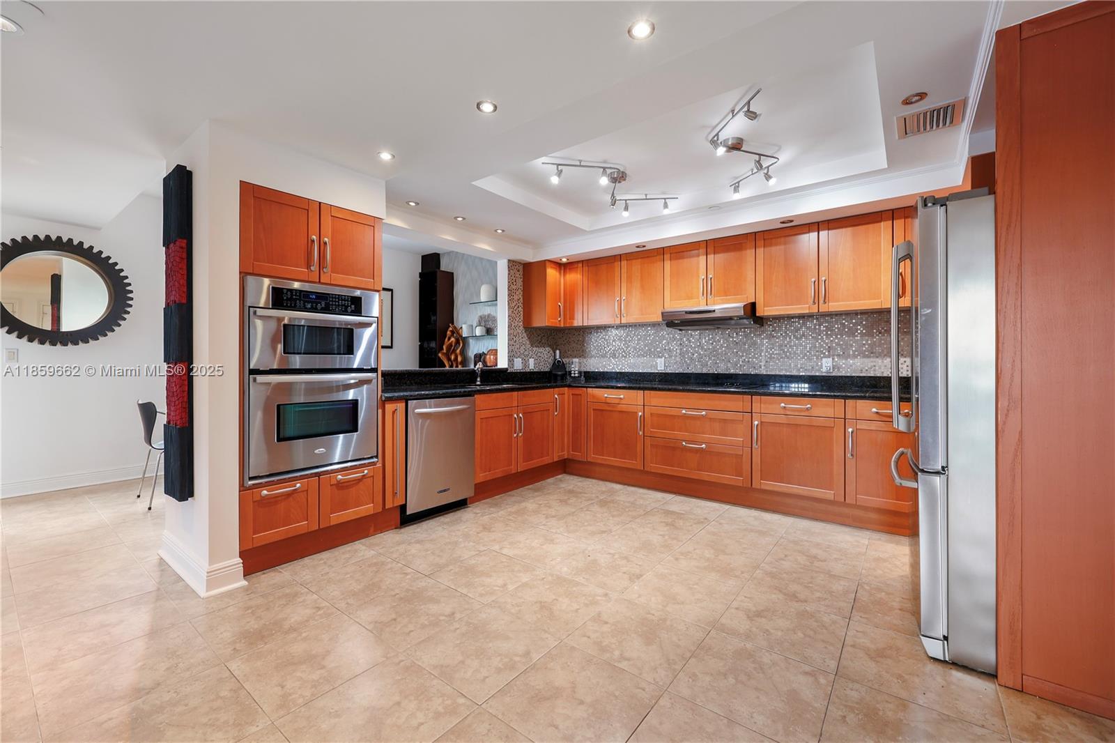 110 Hendricks Isle, Unit 13 Fort Lauderdale, FL 33301 - Photo 22 of 80 a kitchen with stainless steel appliances granite countertop a sink and cabinets