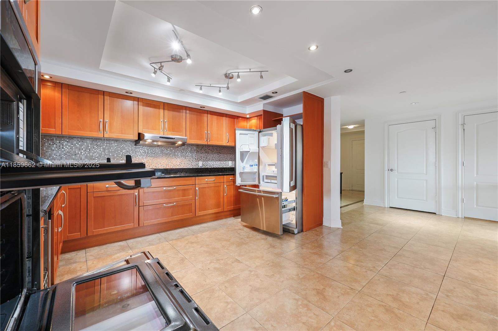 110 Hendricks Isle, Unit 13 Fort Lauderdale, FL 33301 - Photo 24 of 80 a kitchen with stainless steel appliances granite countertop a refrigerator and a sink