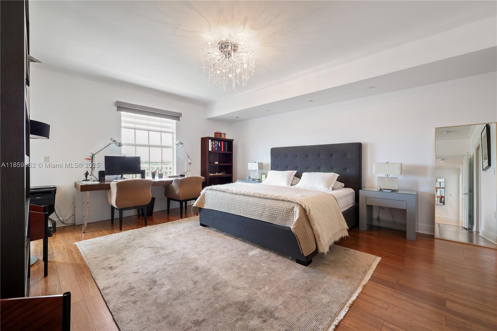 110 Hendricks Isle, Unit 13 Fort Lauderdale, FL 33301 - Photo 32 of 80 a spacious bedroom with a bed a table and window