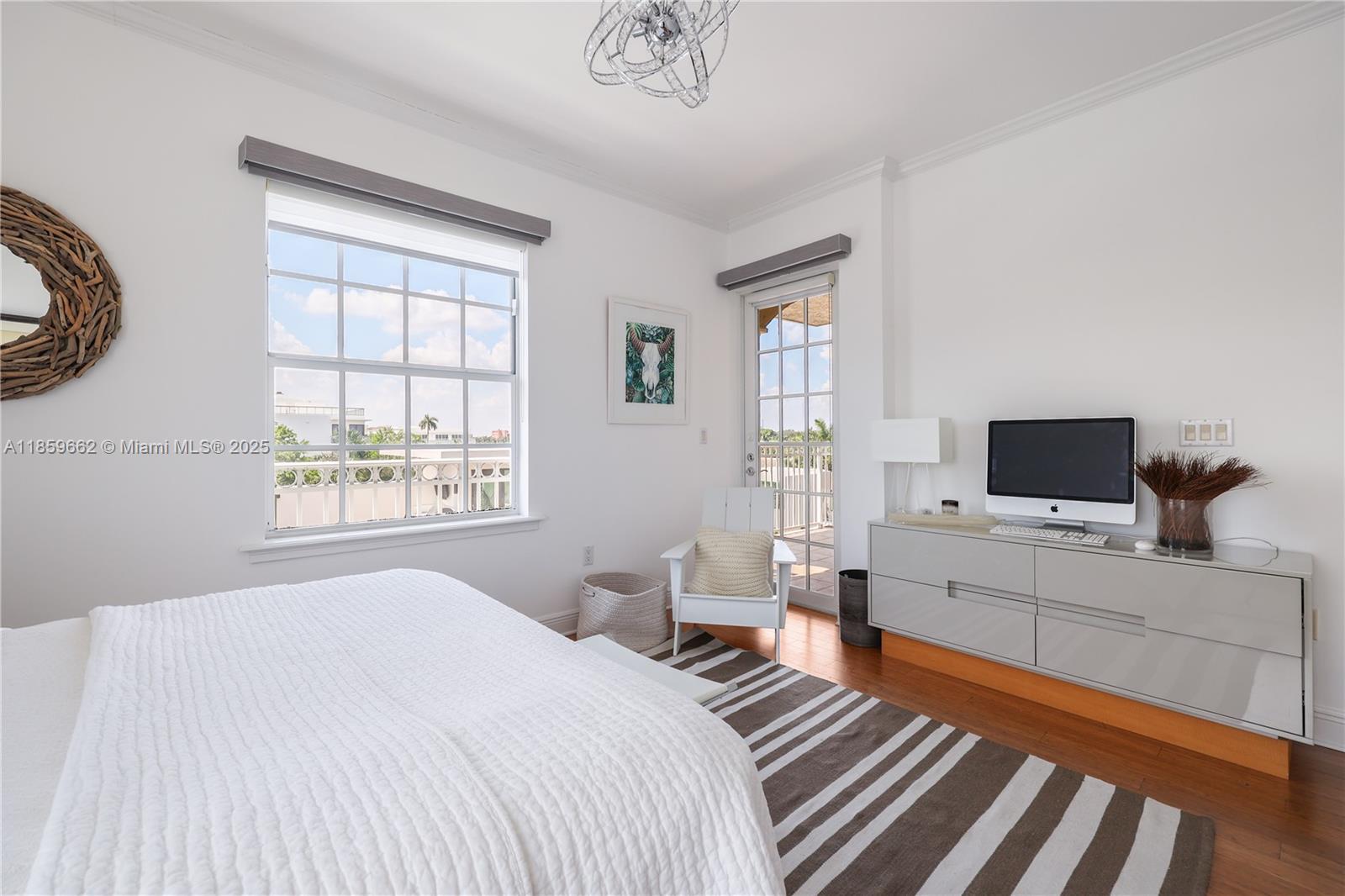 110 Hendricks Isle, Unit 13 Fort Lauderdale, FL 33301 - Photo 36 of 80 a bedroom with furniture and a flat screen tv