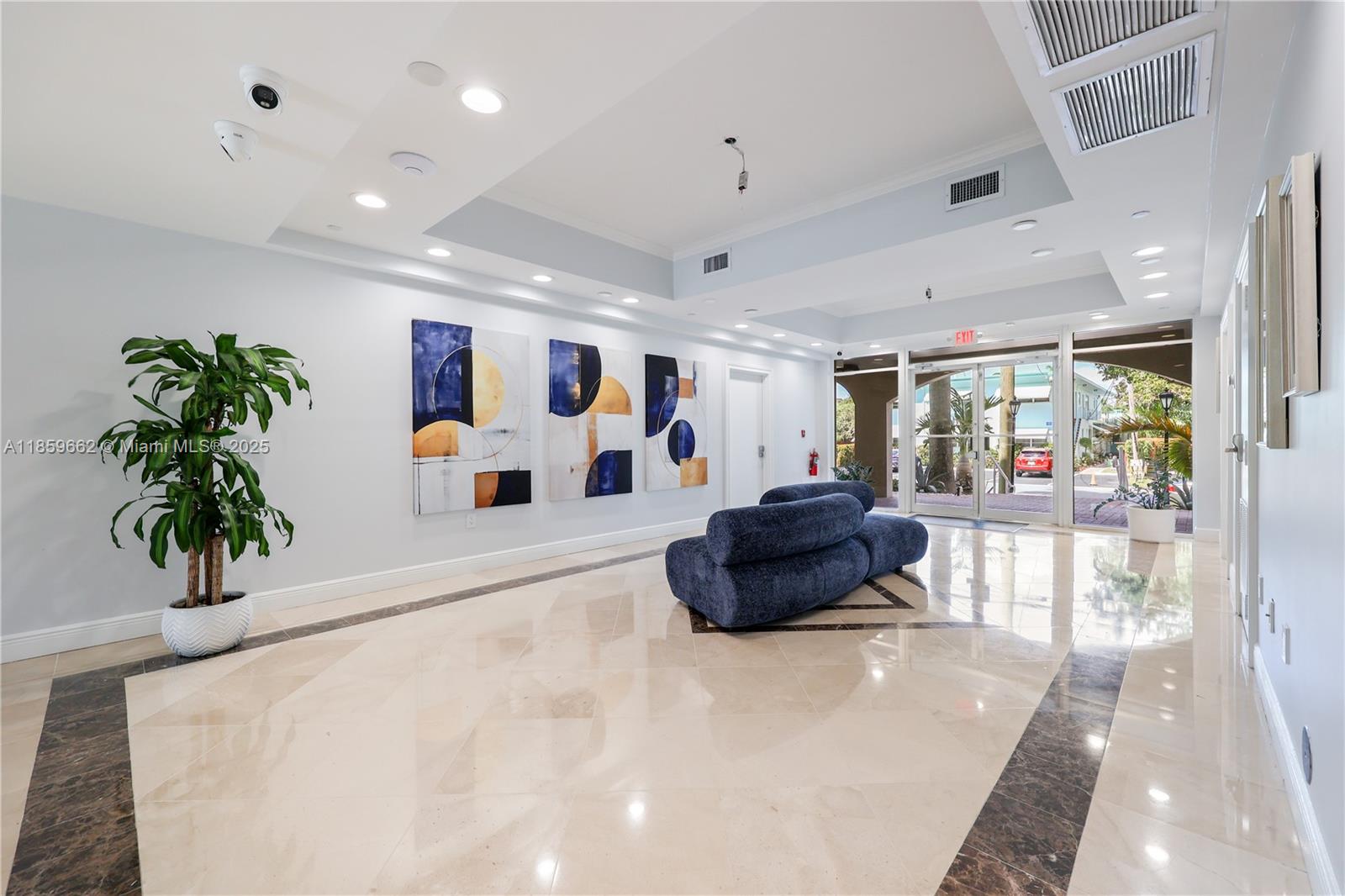 110 Hendricks Isle, Unit 13 Fort Lauderdale, FL 33301 - Photo 4 of 80 a living room with furniture and a potted plant