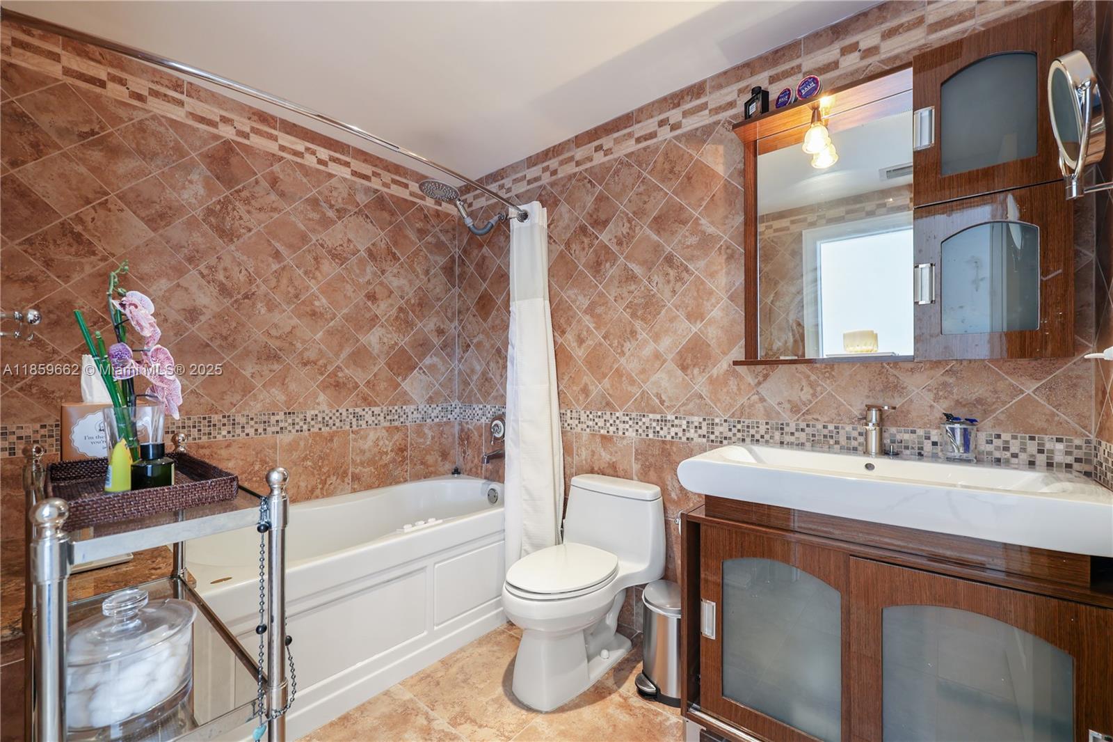 110 Hendricks Isle, Unit 13 Fort Lauderdale, FL 33301 - Photo 43 of 80 a bathroom with a sink toilet and shower