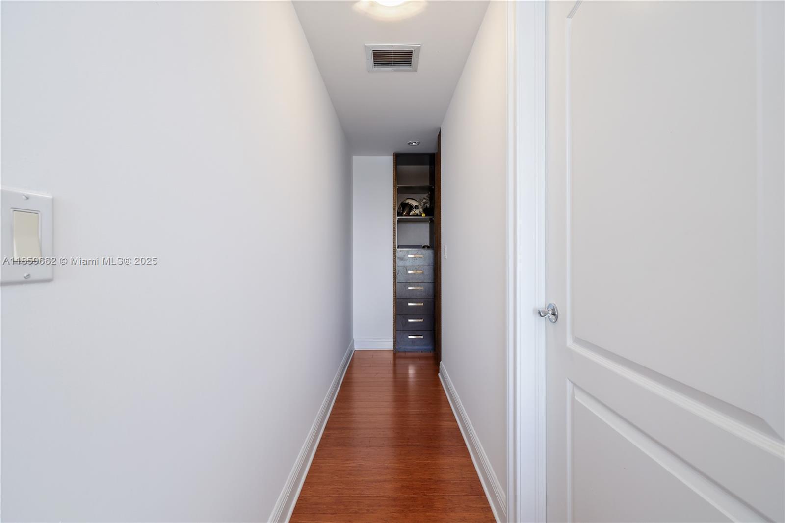 110 Hendricks Isle, Unit 13 Fort Lauderdale, FL 33301 - Photo 51 of 80 a view of a hallway with wooden floor and entryway