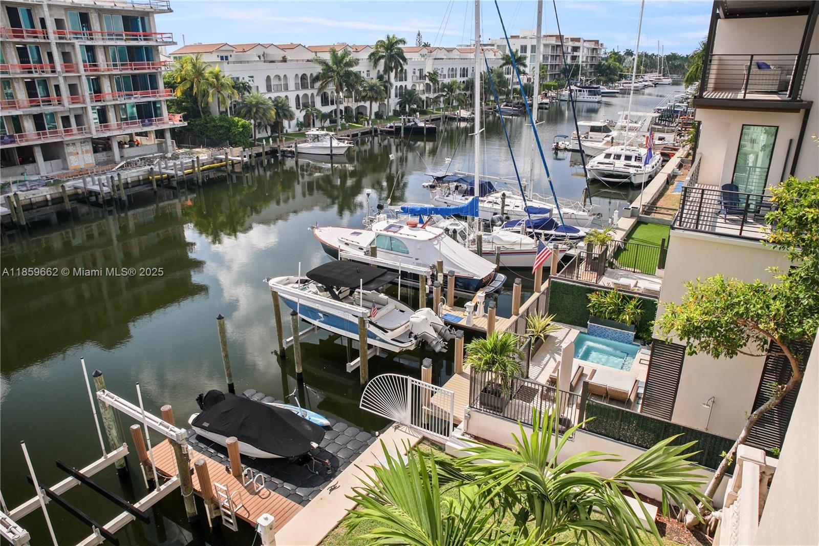 110 Hendricks Isle, Unit 13 Fort Lauderdale, FL 33301 - Photo 53 of 80 a view of a lake with a table and chairs