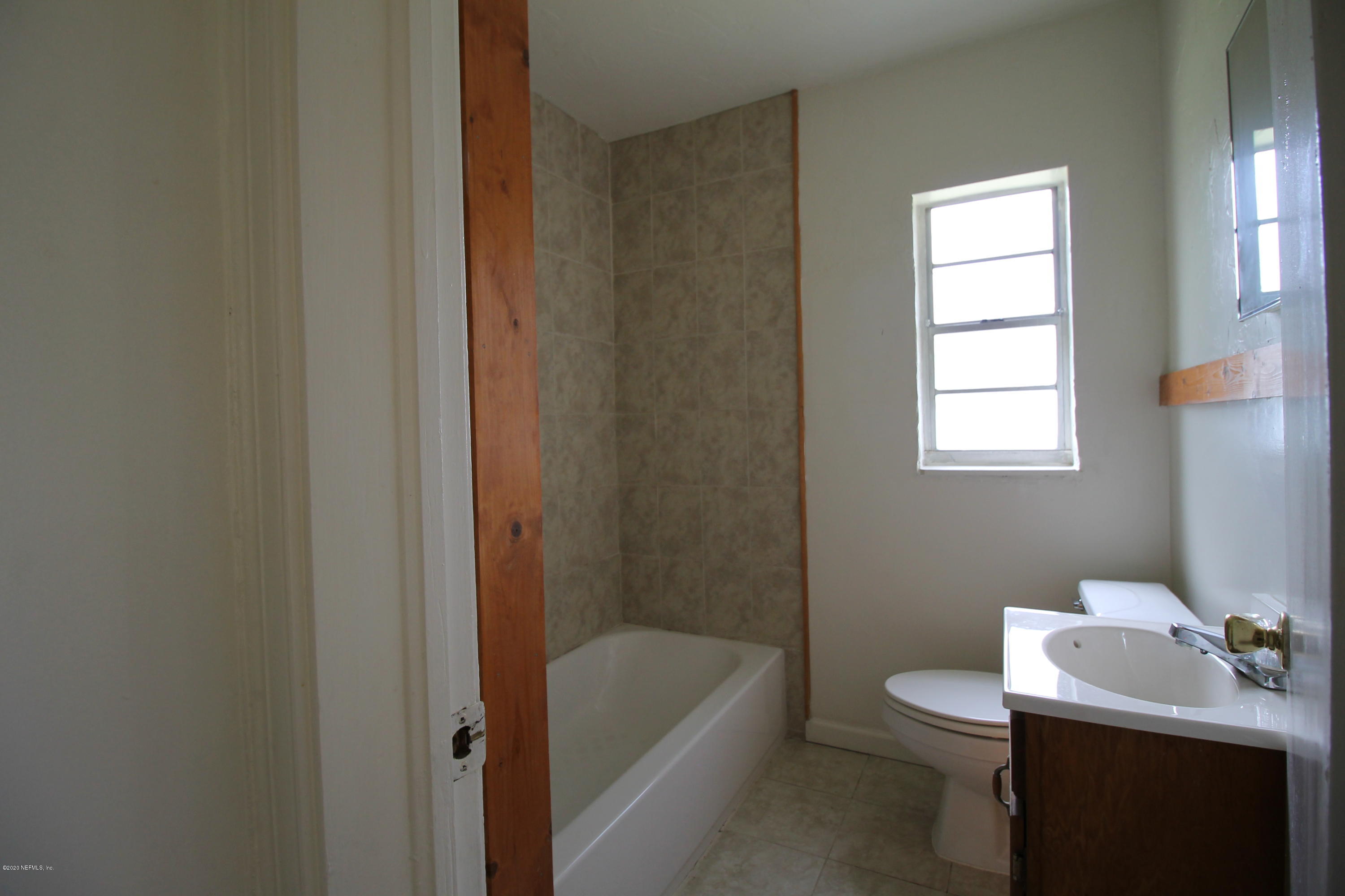 1728 Layton Road Jacksonville, FL 32211 - Photo 11 of 20 a bathroom with a sink toilet and tub