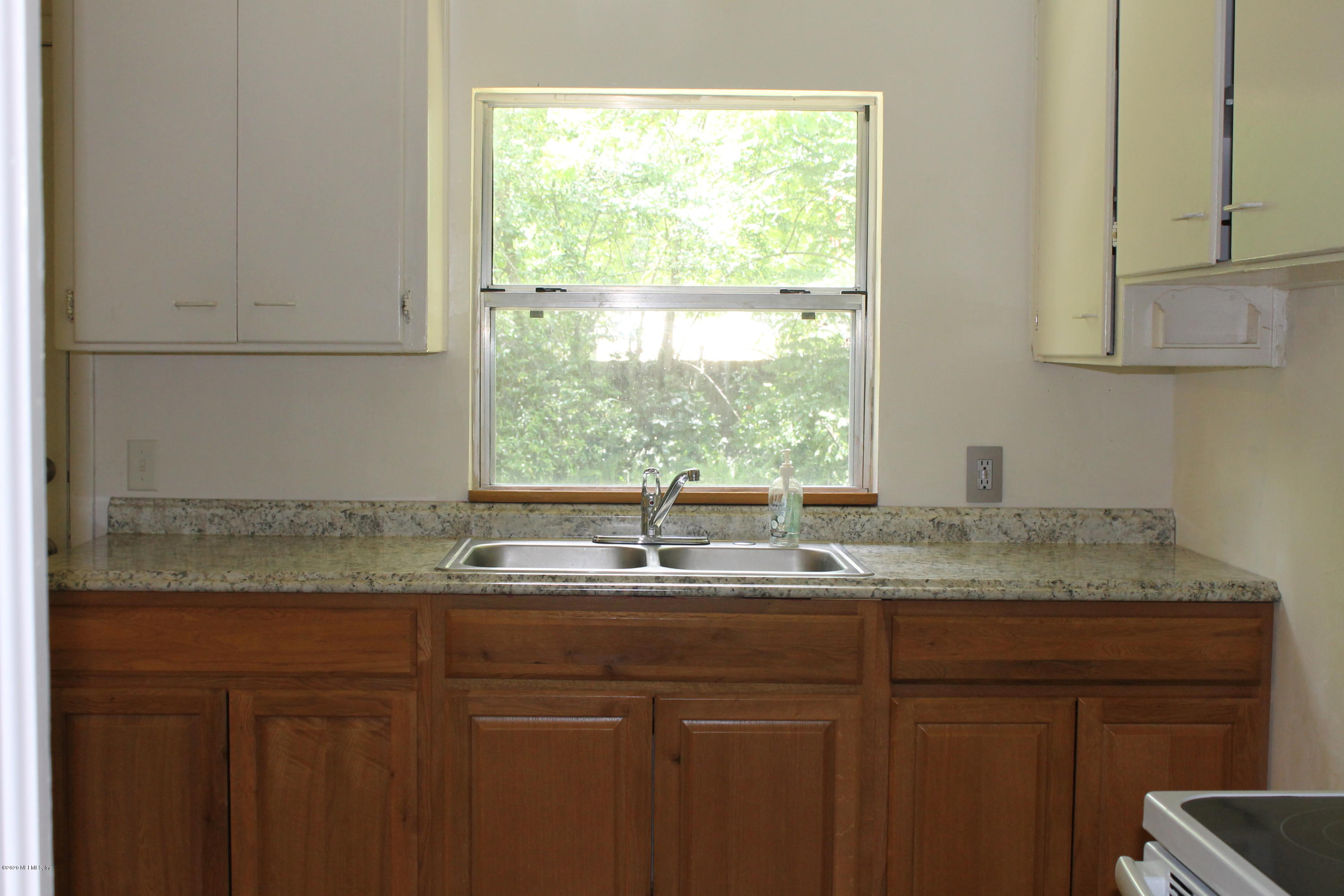 1728 Layton Road Jacksonville, FL 32211 - Photo 8 of 20 a kitchen with a sink and a window
