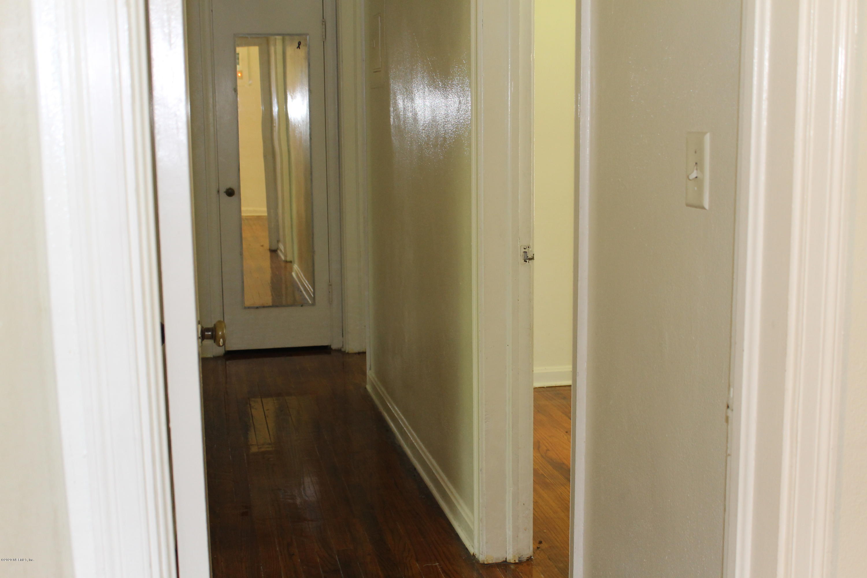 1728 Layton Road Jacksonville, FL 32211 - Photo 9 of 20 a view of a hallway with wooden floor
