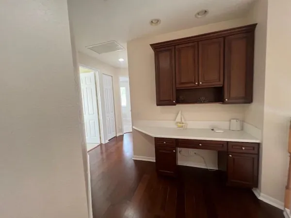 a kitchen with stainless steel appliances a sink and a microwave