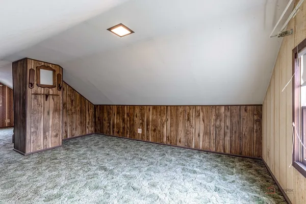 a view of a room with wooden walls