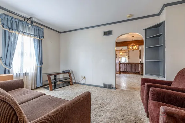 a living room with furniture and a window