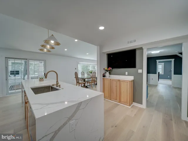 a view of a dining room with furniture and a livingroom